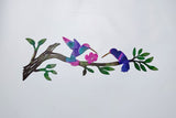 Humming birds on a branch