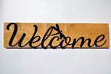 Welcome sign on wood