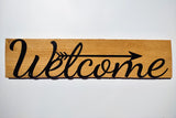 Welcome sign on wood