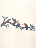 Humming birds on a branch