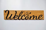 Welcome sign on wood